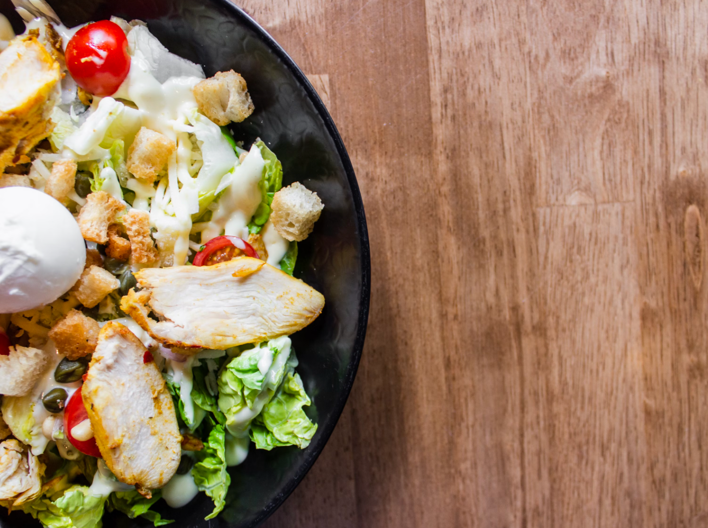 Gourmet Greens: Crafting a Unique Garlic-Infused Olive Oil Caesar Salad